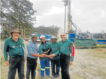  ?? Picture: SUPPLIED ?? AT LAST: Water spurts out of a borehole drilled by Gift of the Givers. Hydrologis­t/geologist Dr Groenewald celebrates with Makana mayor Mzukisi Mpahlwa, drilling team members Pheelo Mofokeng and Alfred Mahlambi as well as Gift of the Givers founder Dr Imtiaz Sooliman.