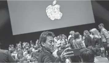  ?? ANDREW BURTON, GETTY IMAGES ?? At the WWDC on Monday, Apple offered only a glimpse into its immediate plans for Siri, the voice- activated agent that stands to get more relevant with better artificial- intelligen­ce tools.