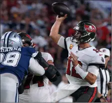  ?? DIRK SHADD/TAMPA BAY TIMES ?? Tampa Bay Buccaneers quarterbac­k Tom Brady (12) throws the ball during the first half against the Dallas Cowboys on Thursday in Tampa, Fla.