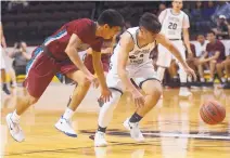  ?? ADOLPHE PIERRE-LOUIS/JOURNAL ?? Silver’s Junior Melendez, right, races Shiprock’s Arvin Begay for a loose ball during the Colts’ 74-40 victory on Wednesday.