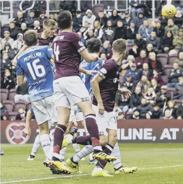  ?? PICTURE: RODDY SCOTT/SNS ?? 0 Jimmy Dunne heads home Hearts’ second goal to all but seal the victory.