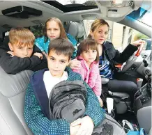  ?? DARREN MAKOWICHUK ?? Sarah Bieber with her children, from left, Kai, 10, Halle, 8, Cora, 6, and Jayce, 11. Bieber, a member of the Kids Come First advocacy group, wants the Calgary Board of Education to change its reports cards so they more accurately reflect the skills of...