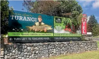  ??  ?? The Taupo¯ District Council wants Ross Baker to remove the black and white signs stipulatin­g directions as they break NZTA rules, but the Turangi businessma­n is refusing to comply.