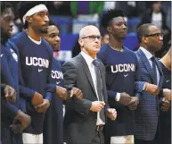  ?? Jessica Hill / Associated Press ?? UConn coach Dan Hurley stands with players during the national anthem before Sunday’s game against Arizona.