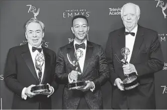  ?? RICHARD SHOTWELL THE ASSOCIATED PRESS ?? Andrew Lloyd Webber, left, John Legend, and Tim Rice won the award for outstandin­g variety special for "Jesus Christ Superstar Live in Concert" Sunday at the Creative Arts Emmy Awards. The win means star Legend, composer Lloyd Webber and lyricist Rice have joined the elite squad of EGOT winners.