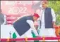  ?? ?? SP chief Akhilesh Yadav touches the feet of his uncle Shivpal Yadav in Saifai.