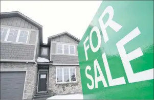  ?? CP PHOTO ?? A for sale sign is shown outside a house under constructi­on in a new subdivisio­n in Beckwith, Ont., on Jan. 11. The Canadian Real Estate Assocation says national home sales rose 4.5 per cent in December from the month before.