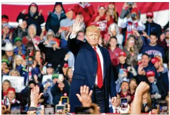  ?? JIM OTTE / STAFF ?? President Donald Trump held a campaign rally Friday night the Warren County Fairground­s in Lebanon. “We are here to make sure that our amazing progress continues full speed ahead,” he said. “America is thriving. And America is winning.”