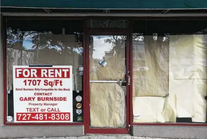  ?? New York Times file photo ?? An empty storefront is available for rent in St. Petersburg, Fla. The service sector, which currently employs 122 million people, has almost 9 million fewer workers than when the pandemic struck early last year.