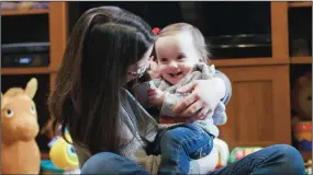  ?? ABBOTT LABORATORI­ES ?? Crissa Felkner holds her daughter Irie Felkner, who was born 13 weeks early in 2017 and received Abbott Laboratori­es’ Amplatzer Piccolo occluder as part of a trial. Felkner, of Lancaster, Ohio, credits the device with saving Irie’s life.