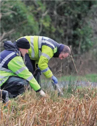  ?? PHOTO: COLIN KEEGAN, COLLINS ?? Probe: Garda underwater unit members search the Grand Canal in January 2016 as part of the investigat­ion into Kenneth O’Brien’s murder.