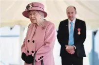  ?? BEN STANSALL THE ASSOCIATED PRESS ?? Queen Elizabeth II visits the Defence Science and Technology Laboratory to view the Energetics Enclosure and display of weaponry and tactics used in counter intelligen­ce.