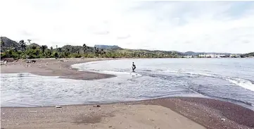  ??  ?? A man fishes on the beach next to the mouth of the Macaguaní River in the Caribbean Sea, on the outskirts of the city of Baracoa in eastern Cuba. — Jorge Luis Baños/IPS photo