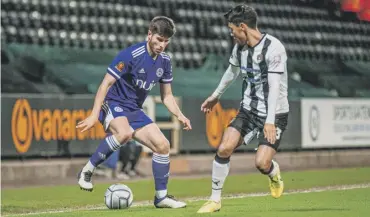  ?? ?? EYES ON THE BALL: Town’s Kian Spence in action during Tuesday night’s 1-1 draw at Notts County.