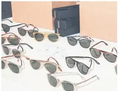  ??  ?? ABOVE A selection of sunglasses await Mr Bezamat’s final inspection.