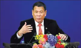  ?? WU HONG/ REUTERS ?? Philippine­s President Rodrigo Duterte speaks at a trade and investment forum Thursday in Beijing.