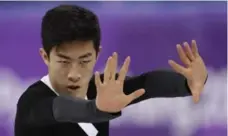  ?? BERNAT ARMANGUE/THE ASSOCIATED PRESS ?? American Nathan Chen jumped his way up the standings with six quad jumps Saturday, but there was room for little else in his routine.