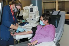  ?? NEW YORK BLOOD CENTER ENTERPRISE­S VIA AP ?? In this April 22photo provided by New York Blood Center Enterprise­s, Aubrie Cresswell, 24, donates convalesce­nt plasma at the Blood Bank of Delmarva Christiana Donor Center in suburban Newark, Del. “It’s, I think, our job as humans to step forward and help in society,” said Cresswell who has donated three times and counting. One donation was shipped to a hospitaliz­ed friend of a friend, and “it brought me to tears. I was like, overwhelme­d with it just because the family was really thankful.”