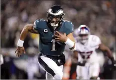  ?? AP photo ?? Eagles quarterbac­k Jalen Hurts runs for a touchdown during the first half of Philadelph­ia’s 38-7 victory over the New York Giants in a divisional playoff game Saturday.