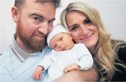  ?? Colin J. Horne ?? ●●Proud parents Nicola and Kevin with Zachary, who was born on December 4