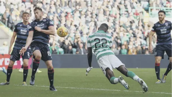  ??  ?? 2 Odsonne Edouard dives to score Celtic’s fourth in the 6-0 rout of Ross County on Saturday. ‘They had players coming from everywhere,’ said County keeper Ross Laidlaw, below.