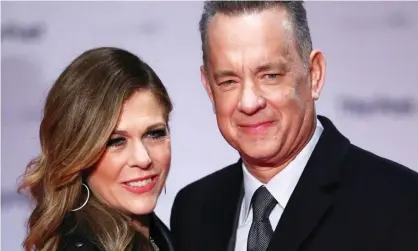  ??  ?? ‘I have learned not to spread my Vegemite so thick’ ... Tom Hanks and Rita Wilson remain self-quarantine­d after testing positive. Photograph: Neil Hall/EPA