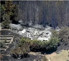  ?? GEORGE HEARD/STUFF ?? A home was gutted by the fire in Redwood Valley, Nelson.