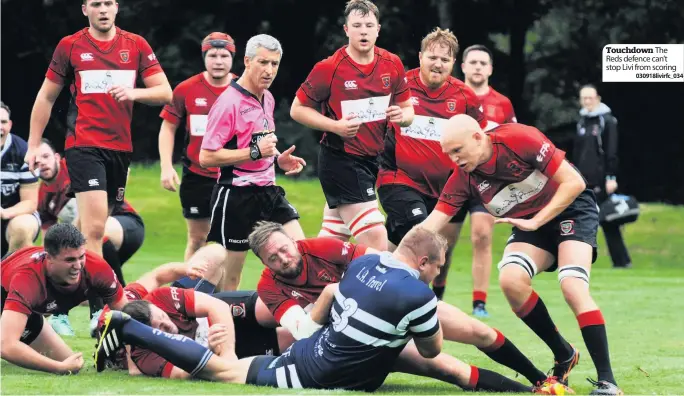  ?? 030918livi­rfc_034 ?? Touchdown The Reds defence can’t stop Livi from scoring