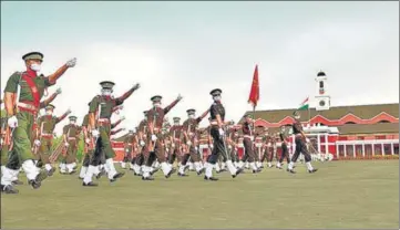  ??  ?? MARCHING ON AMID COVID Newly-inducted officers march during the passing-out parade at Indian Military Academy in Dehradun on Saturday. A total of 423 officers passed out from the academy.