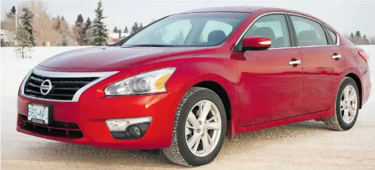  ?? Photos: Tim Yip/ Edmonton Journal ?? The 2013 Nissan Altima 2.5 SL has been given a minor exterior makeover, giving it a fresh but familiar look with more pronounced fender flares, larger grille and more angular, bolder headlights.