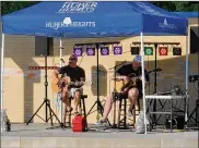  ??  ?? Two for the Road performs for patrons of the Kroger Aquatics Center at the Heights.