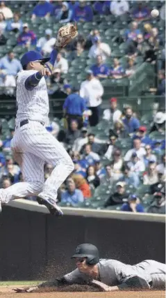  ?? FOTO: AFP ?? >Los Cachorros se aprovechar­on de unos alicaídos Marlins.