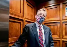  ?? J. Scott Applewhite / Associated Press ?? Republican Rep. Paul Gosar of Arizona takes an elevator as the House of Representa­tives prepares Wednesday to vote on a resolution to formally rebuke him for tweeting an animated video that depicted him striking Rep. Alexandria Ocasio-cortez, D-N.Y., with a sword.