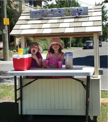  ??  ?? Adela Andrews, left, and sister Eliza were selling lemonade until they were shut down for not having a permit.