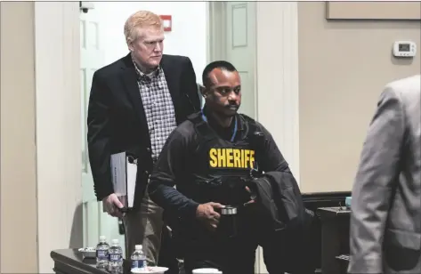  ?? JEFF BLAKE/THE STATE VIA AP ?? Alex Murdaugh is escorted into the courtroom at the Colleton County Courthouse in Walterboro, S.C., before the start of his double murder trial, on Monday.