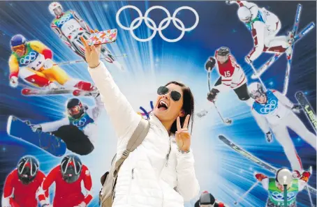 ?? DARREN MAKOWICHUK/FILES ?? Emily Simmons takes a selfie at Canada Olympic Park in Calgary last month. The organizers of a proposal for Calgary to host another Winter Games in 2026 announced this week a $4.6-billion estimated cost to stage the event.