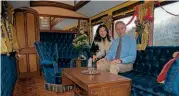  ?? MIKE HEATH ?? Stephen and his wife Qiuying are pictured in the opulent saloon of Queen Victoria's carriage, an experience they invite you to share during a visit to the Embsay & Bolton Abbey Steam Railway.