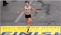  ?? (AP file photo) ?? Emma Bates of Minnesota crosses the finish line of the Boston Marathon on April 17, 2023, in Boston. Bates is hoping to improve on her fifth-place finish of 2 hours, 22 minutes, 10 seconds from last year when she lines up for the marathon today. “I’ve learned that I can run with the best of them,” Bates said.