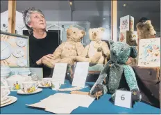  ?? PICTURES: JAMES HARDISTY ?? TREASURE TROVE OF CURIOS: Ilkley Toy Museum owner Alex Samuel with a figure dating from 1912-3, left, a bear called Boris that belonged to a circus boy, above, and Action Man, below; inset, a boy with his bear, Thomas.