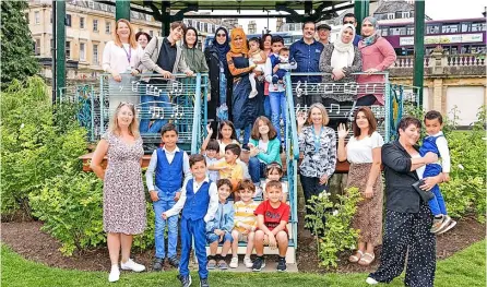  ?? Pic: B&NES Council ?? Councillor Dine Romero (front, left) with the Syrian families and representa­tives from the council