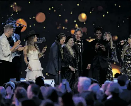  ?? AP PHOTO/CHRIS PIZZELLO ?? Joni Mitchell (fourth from left) and artists perform “Big Yellow Taxi” at the conclusion of the 31st annual MusiCares Person of the Year benefit gala honoring Mitchell on Friday at the MGM Grand Conference Center in Las Vegas.