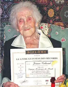  ?? GEORGES GOBET / AFP / GETTY IMAGES FILES ?? Jeanne Calment of France, pictured in 1995 with a Guinness World Records certificat­e, died in 1997 at age 122. Researcher­s posit that within a few decades humans could very well live until 150.