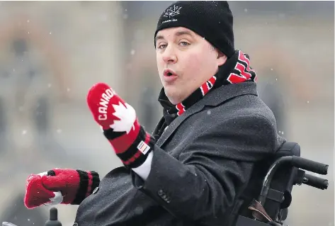  ?? JUSTIN TANG / THE CANADIAN PRESS ?? Minister of Sport and Persons with Disabiliti­es Kent Hehr addresses the official inaugurati­on of the Canada 150 Rink on Parliament Hill Thursday.