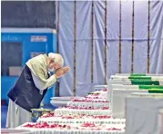  ?? — PTI ?? Prime Minister Narendra Modi pays tribute during a wreath-laying ceremony of Chief of Defence Staff General Bipin Rawat, his wife Madhulika Rawat and other officials killed in an IAF-Mi-17V5 helicopter crash in Coonoor, at Palam Airbase in New Delhi, on Thursday.