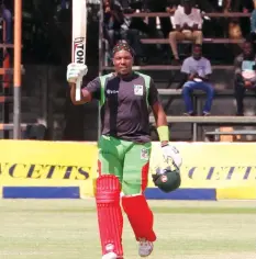  ??  ?? CENTURY MAN . . . Zimbabwe A batsman Hamilton Masakadza raises his bat after reaching his ton at Harare Sports Club yesterday