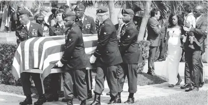  ?? AP ?? Myeshia Johnson follows the casket of her husband, Army Sgt. La David Johnson, in Hollywood, Florida, on Saturday.