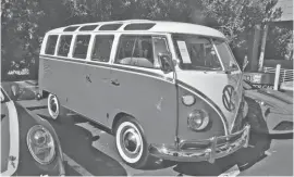  ?? ?? A near-perfect 1964 Volkswagen 21-window microbus sold for a bid of $165,000.