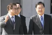  ?? Jung Yeon-je / Associated Press ?? Top South Korean officials Suh Hoon (left) and Chung Eui-yong depart for Pyongyang.