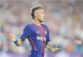  ?? HECTOR RETAMAL/AFP/GETTY IMAGES ?? Speculatio­n is mounting that Neymar could be set to quit Barcelona for Paris Saint-Germain for a world-record $262 million.