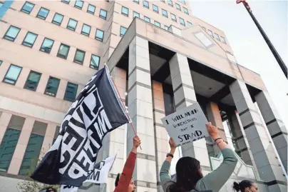  ?? KYLE ROBERTSON/COLUMBUS DISPATCH ?? A demonstrat­ion takes place in front of Columbus Division of Police building Tuesday in downtown. Miles Jackson was shot and killed inside Mount Carmel in Westervill­e by police.